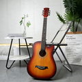 38-inch wooden acoustic guitar with a natural finish, featuring six strings and a classic design, perfect for beginner and experienced players.