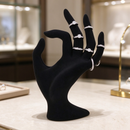 Black velvet female hand mannequin model holding jewelry display stand, showcasing elegant jewelry presentation by dealonlinenz.