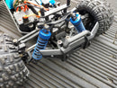 Dealonlinenz 1:18 scale 4WD electric RC truggy off-road vehicle with high speed and rugged tires on dirt track.