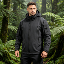 Men's military tactical soft shell jacket, water-resistant windbreaker in black, featuring multiple pockets and adjustable cuffs.